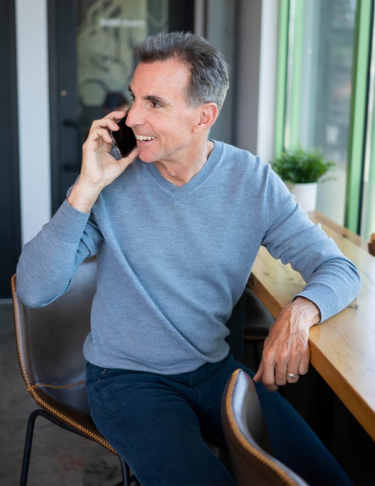 Image of Chief Marketing Officer, Bob Newman, talking on the phone at Paradigm Digital Group offices