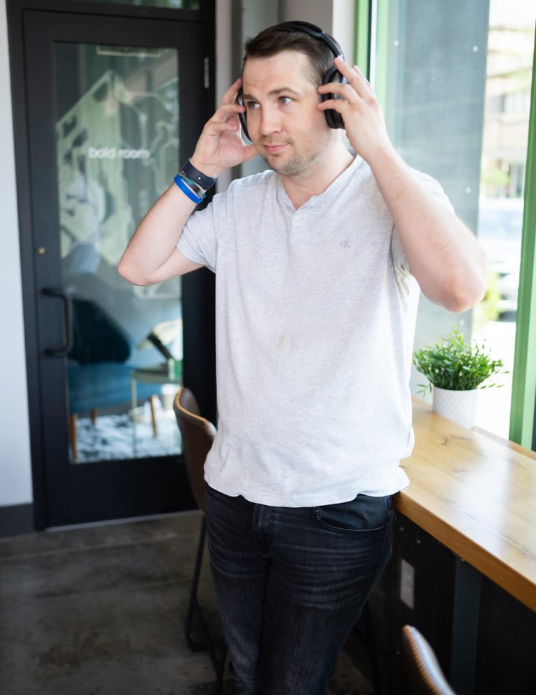 Image of Video Editor, Eric Knifong, listening to headphones at Paradigm Digital group offices